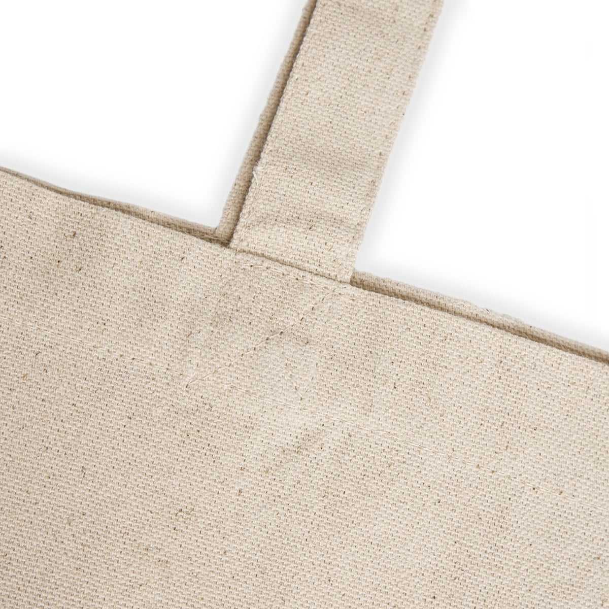 Close-up of a beige tote bag with a white background