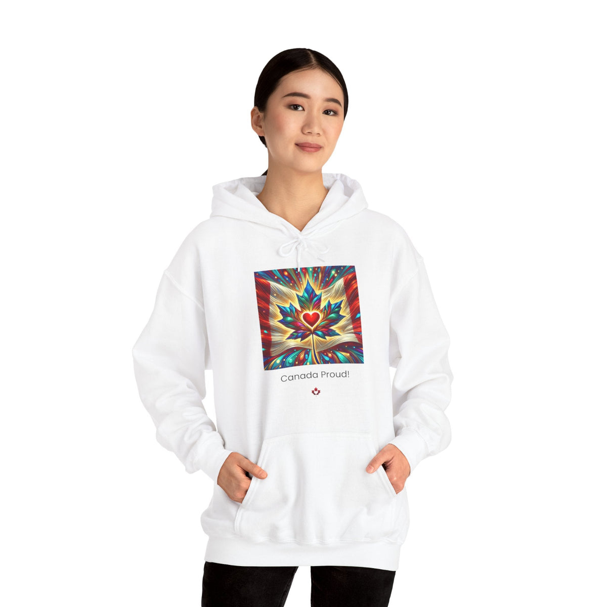 Person wearing a white hoodie with a colorful maple leaf design and 'Canada Proud' text on a white background