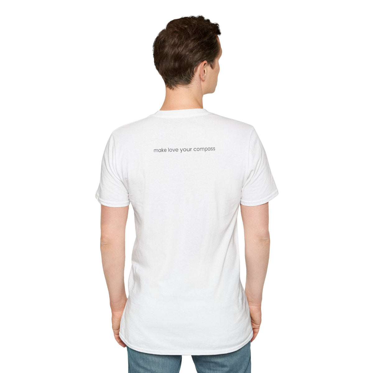 Person wearing a white t-shirt with text on the back, standing against a plain background