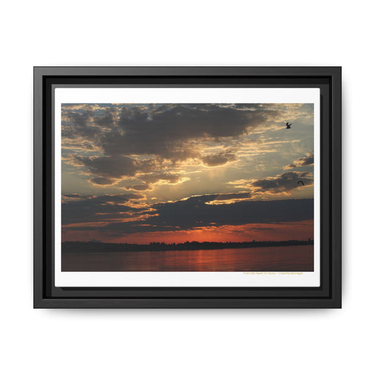 Framed canvas print of a golden sunset over tranquil waters, captured by Caterina Barregar. A peaceful moment in nature titled “From My Heart to Yours.”
