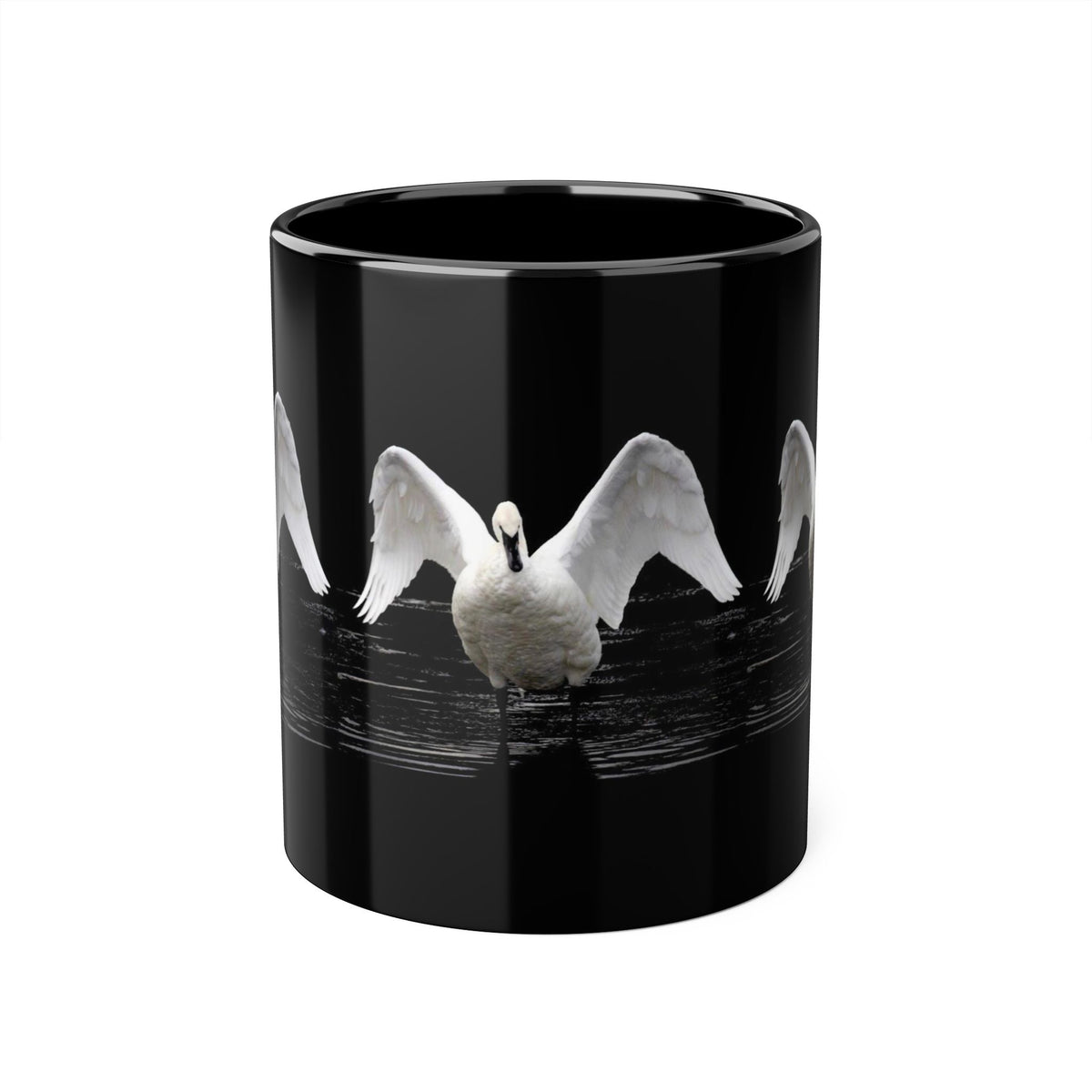 A glossy black ceramic mug featuring a printed graphic of a white swan with wings spread, set against a clean white background.