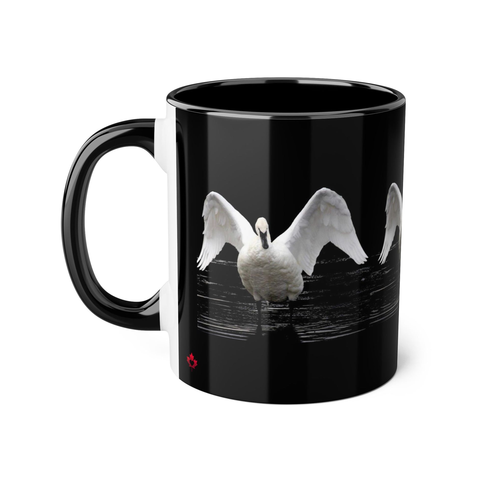 A glossy black ceramic mug featuring a graphic print of a white swan with wings spread, set against a clean white background.
