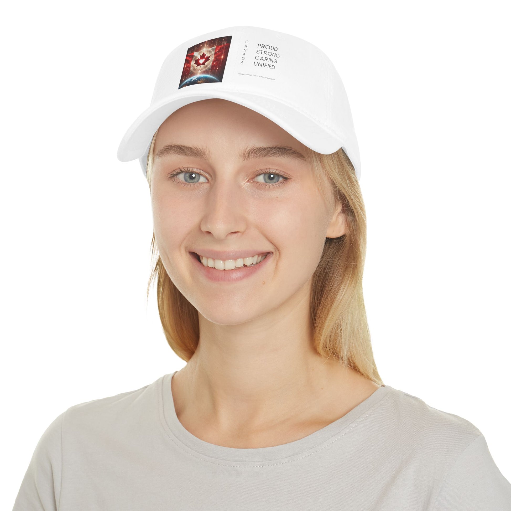 Woman wearing a white baseball cap with a Canadian flag and heart design, labeled “Proud, Strong, Caring, Unified.” Canadian-made by Make Love Your Compass™.