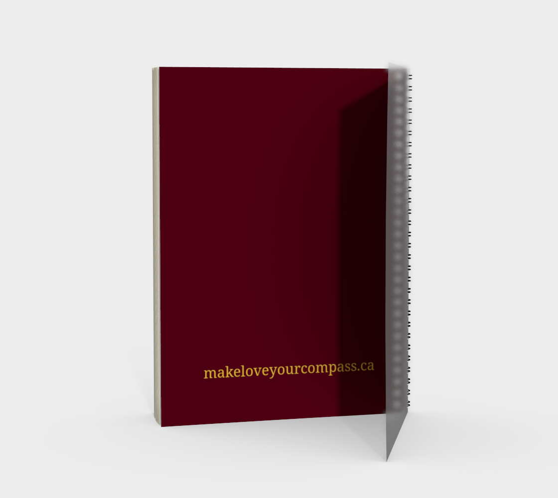 Maroon notebook with gold text on a white background