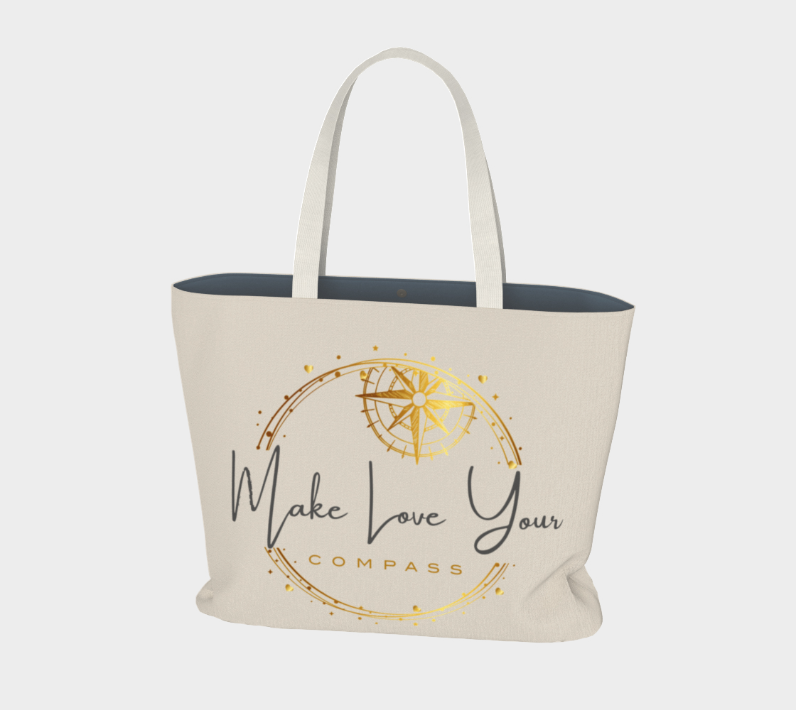 Beige tote bag with gold and black text and design on a white background