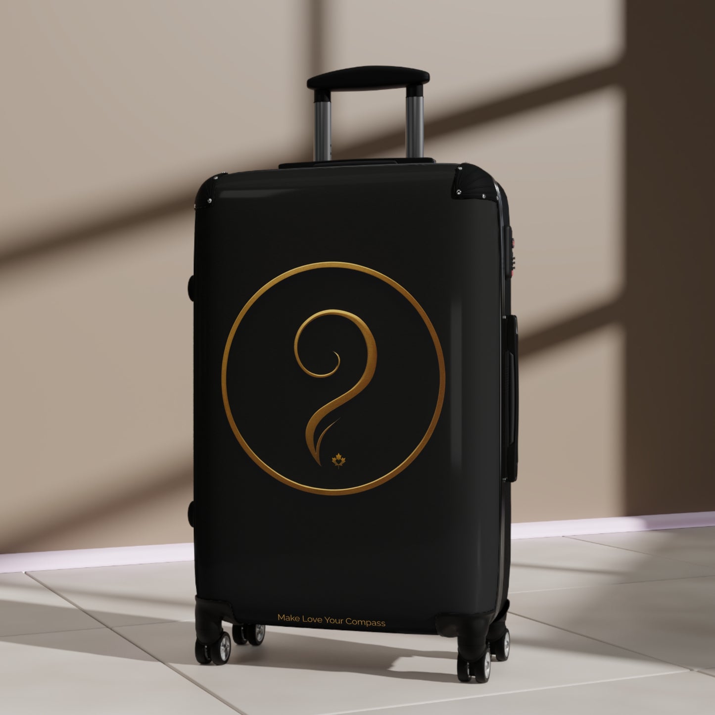 Black suitcase with a gold logo on a beige floor