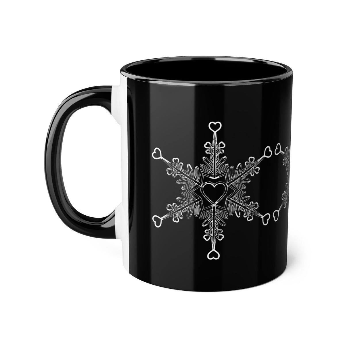 Make Love Your Compass 11oz ceramic accent mug with a sleek black exterior and interior, featuring a delicate white snowflake made of tiny hearts.