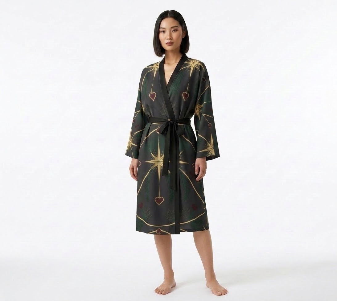 Female model wearing a knee-length Compass and Hearts silk peignoir with handcrafted art print on a white background.  