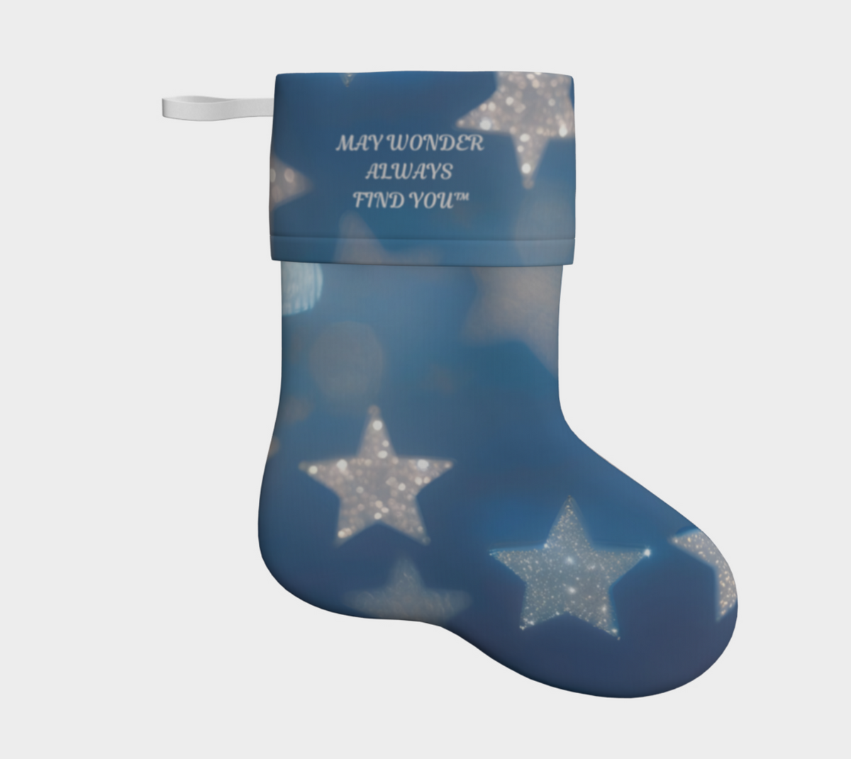 A blue Christmas stocking with a white hanging loop, featuring a pattern of glittery silver stars and the printed text 'MAY WONDER ALWAYS FIND YOU' on the cuff, shown against a light grey background.
